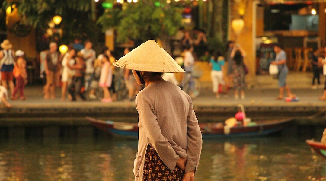 Lady lost in thought by the river, Hoi An, Vietnam. Katherine McCormack@Unsplash