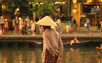 Lady lost in thought by the river, Hoi An, Vietnam. Katherine McCormack@Unsplash