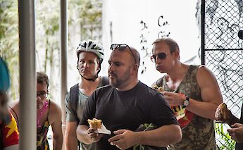 Bike tourists enjoying their sandwich, Hoi An, Vietnam. Grasshopper Day Tours
