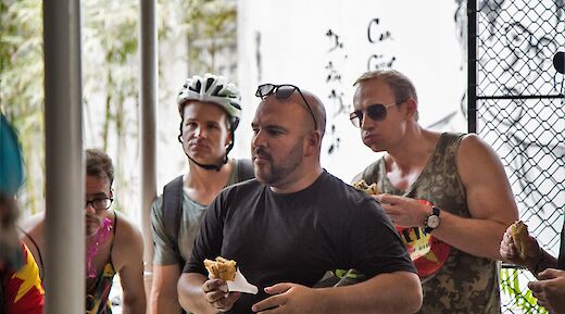 Bike tourists enjoying their sandwich, Hoi An, Vietnam. Grasshopper Day Tours