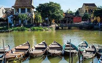 Small local row boats docked at Hoi An, Vietnam. Grasshopper Day Tours