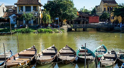 Small local row boats docked at Hoi An, Vietnam. Grasshopper Day Tours