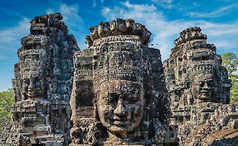 Faces carved in stone, Siem Reap, Cambodia. Unsplash@Getty Images