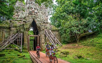 Biking through Angkor Temple, Siem Reap, Cambodia. Grasshopper Day Tours