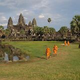 Monks walking through the grounds of Angkor Wat, Siem Reap, Cambodia. Dick Hoskins@Unsplash