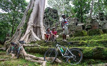 Resting off the bikes, listening to the tour's lecture, Siem Reap, Cambodia. Grasshopper Day Tours