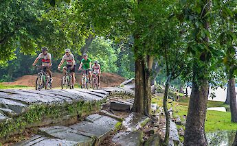 Biking up stone paths at Angkor Temples, Siem Reap, Cambodia. Grasshopper Day Tours