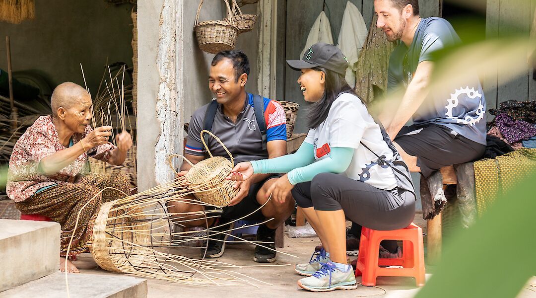 Learning basket weaving from a local in Siem Reap, Cambodia. Grasshopper Day Tours