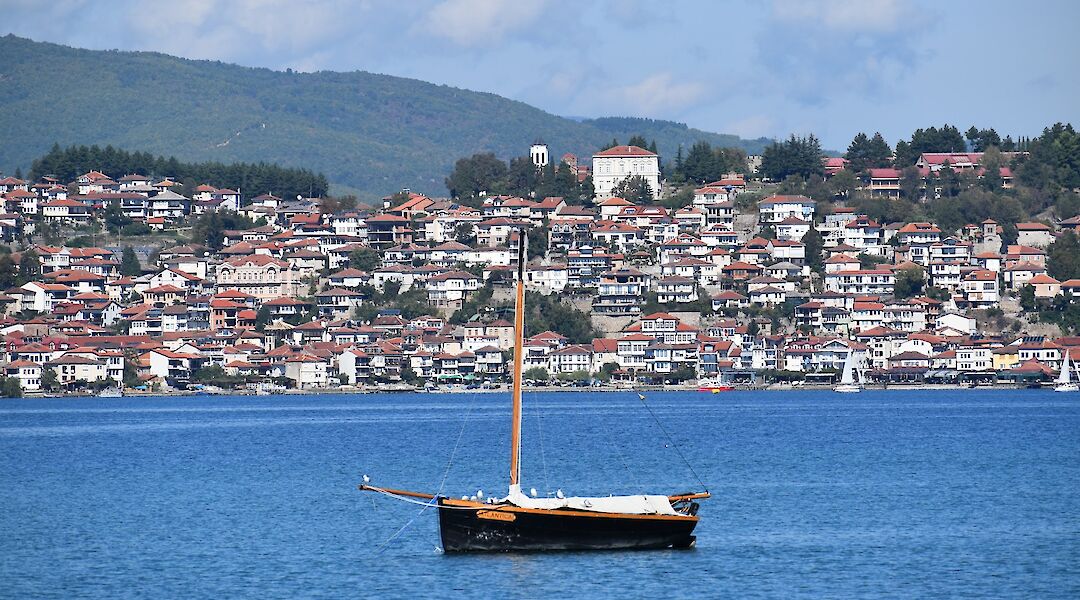 Lone sailboat in the lake, Lake Ohrid, Macedonia, Albania. Bojan Bogdanovski@Unsplash