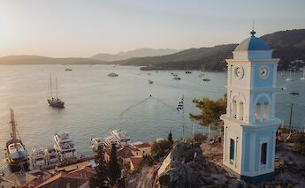 A clock tower guiding ships back to the harbor. -toIH