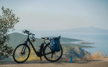 Pausing along the panoramic coastal route with stunning Aegean vistas. -toIH
