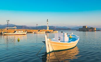Nafplio – the Bourtzi fortress rising from the bay, seen from the old port.. -toIH