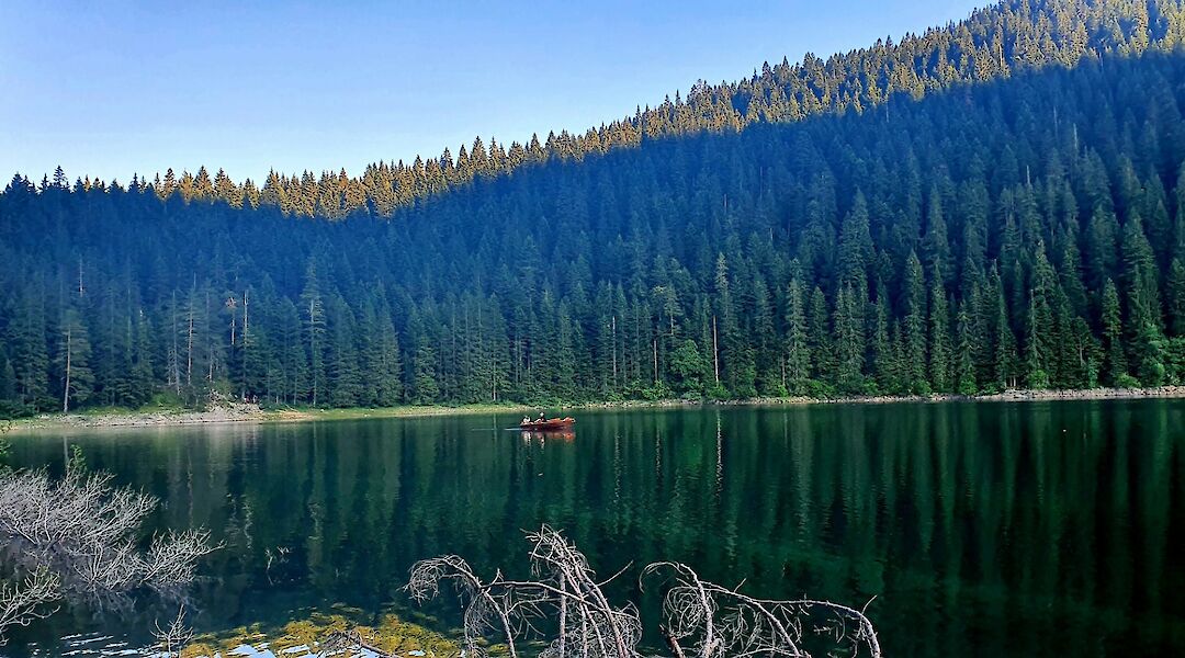 Boat on a lake, Durmitor, Montenegro. Unsplash: Fedir Petryk