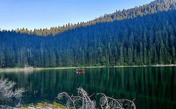 Boat on a lake, Durmitor, Montenegro. Unsplash: Fedir Petryk