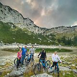 Bike tourists posing by one of the lakes, Zabljak, Montenegro.
