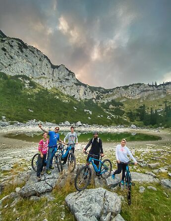Bike tourists posing by one of the lakes, Zabljak, Montenegro.
