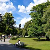 Reading on a bench at Djurgarden, Stockholm, Sweden. Flickr: Dan