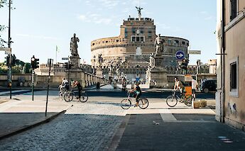 Biking past Castel Sant'Angelo, Rome, Italy. Unsplash: Gabriella Clare Marino