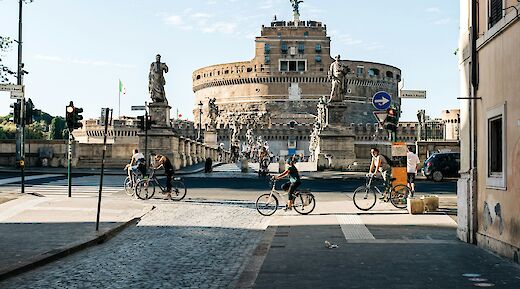 Biking past Castel Sant'Angelo, Rome, Italy. Unsplash: Gabriella Clare Marino