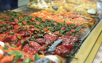 Pizza shop, Rome, Italy. Sarahcreates@Unsplash