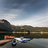 Canoes and a small boat, Black Lake, Zabljak, Montenegro. Daniel Hering@Unsplash