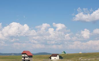 Houses on the Fields of Durmitor, Montenegro. Aleksandr Zykov@Unsplash