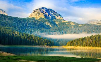 Mountain peak against the golden sunlight in Zabljak, Montenegro. Shant Dem@Unsplash