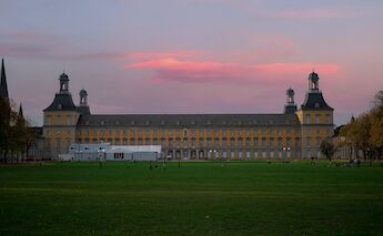 Purple and orange skies over the University of Bonn and Hofgarten, Bonn, Germany. Fynn Geersden@Unsplash
