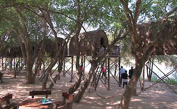 Houses on stilts along the river on Silk Island, Phnom Penh, Cambodia. Flickr: knittymarie