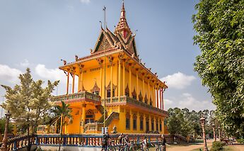 Yellow temple in Mekong, Phnom, Penh, Cambodia. Grasshopper Active Tours