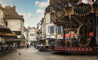 Carousel in Dijon, France. Unsplash:Peter Herrmann