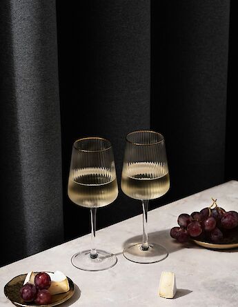 Wine, cheese & grapes, France. Unsplash:Uliana Kopanytsia