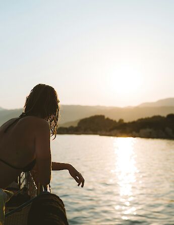 Woman looking at the sea after a swim in Fethiye, Turkey. Unsplash:Dylan Alcock