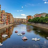 Flower decorations on the river, Girona, Spain. Unsplash:Manuel Torres Garcia