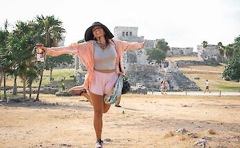 Customer posing at the ruins, Tulum, Mexico. CC:Mexico Kan Tours