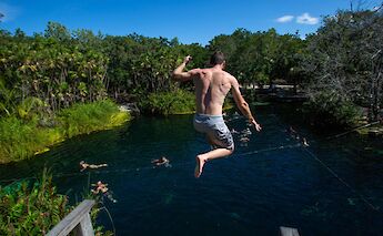 Jumping into a cenote, Tulum, Mexico. CC:Mexico Kan Tours