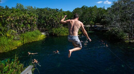 Jumping into a cenote, Tulum, Mexico. CC:Mexico Kan Tours