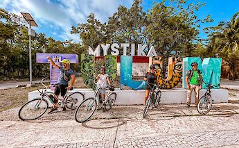 Posing at a Tulum sign, Mexico. CC:Mexico Kan Tours