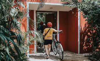 Walking into a traditional building, Tulum, Mexico. CC:Mexico Kan Tours