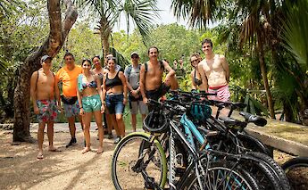 Group photo behind the bikes, Tulum, Mexico. CC:Mexico Kan Tours