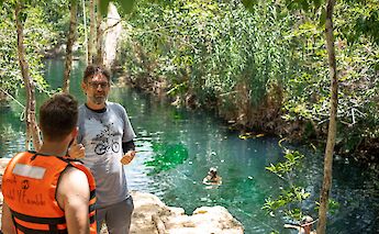 Talking to the tour guide at a cenote, Tulum, Mexico. CC:Mexico Kan Tours