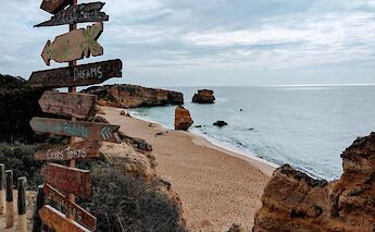 Sign on the beach in Albufeira, Portugal. Unsplash: Conor Rees