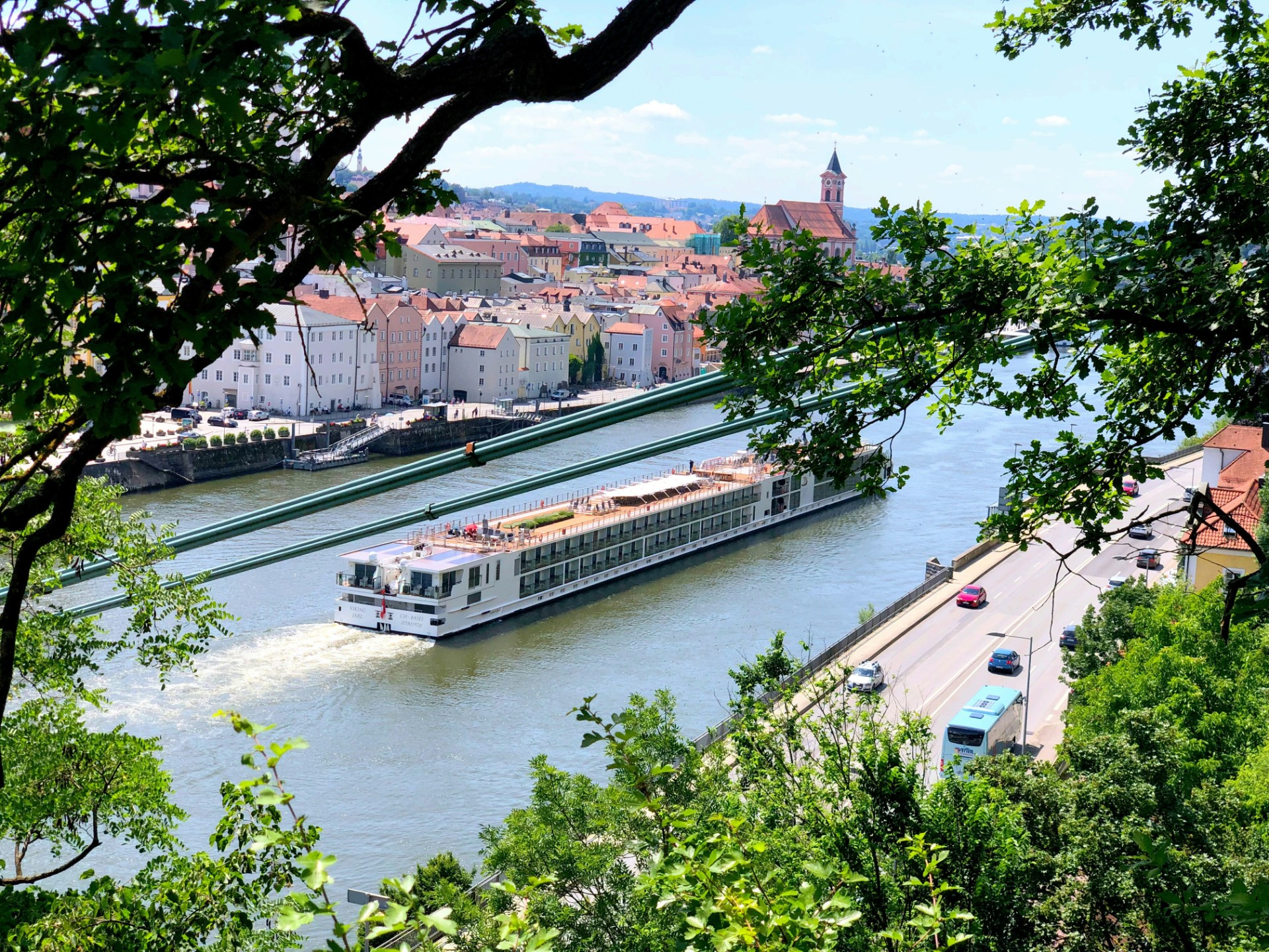 A boat cruising past Passau, Germany, start of the Premium Danube Cruise and Cycle