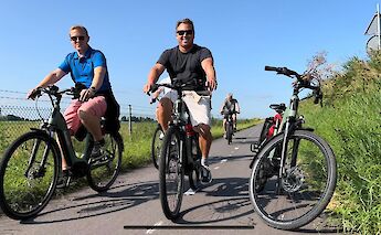 Cycling past the camera, Amsterdam countryside bike tour, Holland. CC:TO