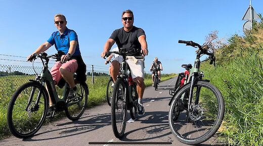 Cycling past the camera, Amsterdam countryside bike tour, Holland. CC:TO