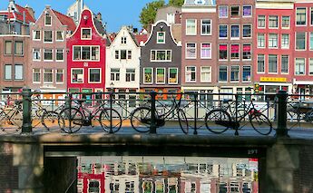 Bikes on a bridge in Amsterdam, Holland. Gaurav Jain@Unsplash