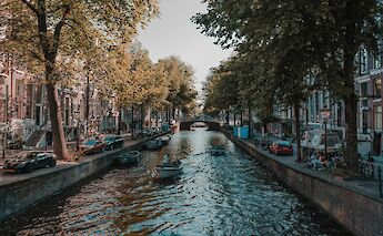 A busy canal in Amsterdam.  Eirik Skarstein@Unsplash