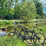 Relaxing by the river.  Danny De Vylder@Unsplash