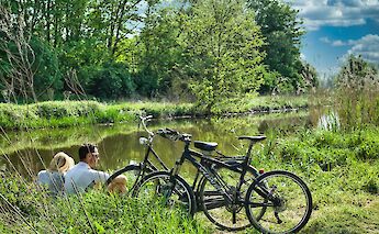 Relaxing by the river.  Danny De Vylder@Unsplash