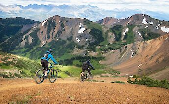 Mountain bike tour in the mountains. Greg Rosenke@Unsplash